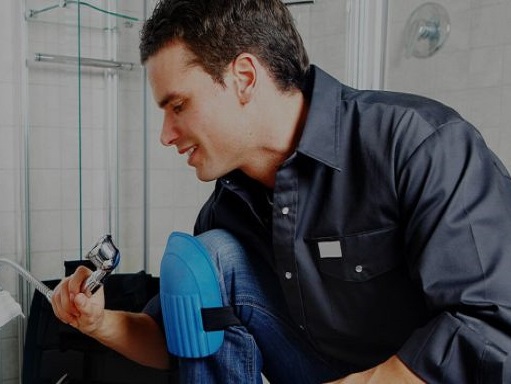 plumber working on shower hose