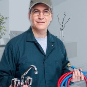 plumber holding water hose and faucet